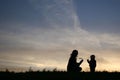 Silhouette mother with baby