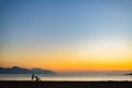 Silhouette of mother with baby stroller enjoying motherhood at s