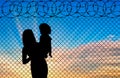 Silhouette of mother and child refugees Royalty Free Stock Photo