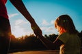 Silhouette of mother and daughter holding hands at sunset Royalty Free Stock Photo