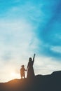 Silhouette of mother with her daughter standing Royalty Free Stock Photo