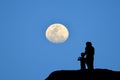 Silhouette of mother and son standing on the mountain, watching Royalty Free Stock Photo