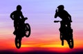 Silhouette of motocross rider jump in the sky Royalty Free Stock Photo