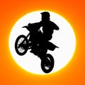Silhouette of motocross rider jump in the sky