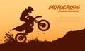 Silhouette of motocross rider on the track