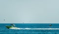 Silhouette of motor boat and wakeboarder jumping crazy trick. Wakeboarder making tricks on the sea pulled by a boat