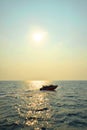 Silhouette Of A Motor Speed Boat At Sunset Royalty Free Stock Photo