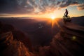 Silhouette of motorbike rider doing stunt on rocky mountain as jump cross slope of mountain with sunset backlit Royalty Free Stock Photo