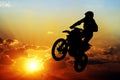 Silhouette of a motorcyclist on a background of dark sky