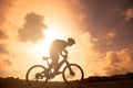 The silhouette of mountain bicycle rider on the hill