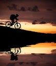 Silhouette of mountain biker with Reflection Royalty Free Stock Photo