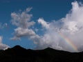silhouette of mountain with rainbow and clouds Royalty Free Stock Photo