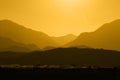 Silhouette of Mountain Range Layered in Amber Royalty Free Stock Photo