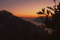 Silhouette of mountain ranges near the ocean during the golden hour Royalty Free Stock Photo