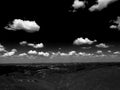 Silhouette of mountains in Bulgaria in summer sunset and many white clouds in the blue sky. Mountainous view. Royalty Free Stock Photo