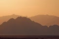 Silhouette of mountains at sunset in the evening at dusk