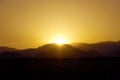 Silhouette of mountains at sunset in the evening at dusk Royalty Free Stock Photo