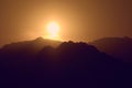 Silhouette of mountains at sunset in the evening at dusk Royalty Free Stock Photo