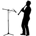 Silhouette of musician playing the clarinet on a white background Royalty Free Stock Photo