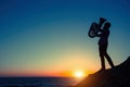 Silhouette of musician with tuba on the ocean beach