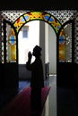 Silhouette of pilgrim ,praying in  mosque Royalty Free Stock Photo