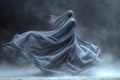 Mysterious figure of woman shrouded in flowing, ghostly fabric in wind against dark misty background Royalty Free Stock Photo