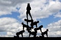 Silhouette narcissistic egoist woman with a crown on his head standing on humans Royalty Free Stock Photo