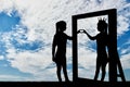 Silhouette of a narcissistic woman with a crown on her head and a hand gesture of the heart in reflection in the mirror. Royalty Free Stock Photo