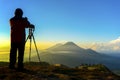 Silhouette nature photographer in action during sunrise