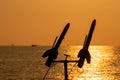 Silhouette of navy sailor is going to shoot paracute rocket from the warship`s deck