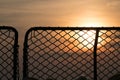 Silhouette of navy ship`s safety net at sea , sunset sky in the background Royalty Free Stock Photo