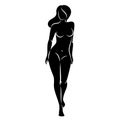 Silhouette of a nice lady, she is standing. The girl has a beautiful naked figure. The woman is a young sexy and slender