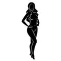 Silhouette of a nice lady, she is standing. The girl has a beautiful naked figure. The woman is a young sexy and slender