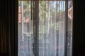 Silhouette noise and grain transparent curtain with sunlight in hotel bedroom