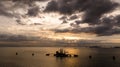 silhouette Offshore Jack Up Drilling Rig in Middle of The Sea at evening, aerial view Royalty Free Stock Photo