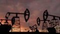 The silhouette of oil pumps in a large oil field at sunrise. 3d rendering. 3d illustration Royalty Free Stock Photo