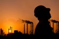 The silhouette of oil refinery worker Royalty Free Stock Photo