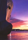 Silhouette oil tanker ship moored at harbor against colorful sunset sky background in evening time and vertical frame Royalty Free Stock Photo