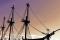 Silhouette of an old, ancient, wooden ship with masts on a sunset background Royalty Free Stock Photo