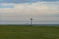 Old Fashioned Windmill along the horizon of a North Dakota Prairie Royalty Free Stock Photo
