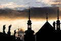 Silhouette of an old Gothic building with spires, crosses and sc