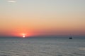 Silhouette of an old Viking ship saling off into the sunset on the Baltic Sea Royalty Free Stock Photo