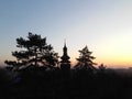 Silhouette of old wooden church with tree on sunset Royalty Free Stock Photo