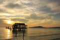 Silhouette of old wooden jetty at sunrise, Koh Rong island, Cambodia Royalty Free Stock Photo