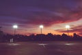 Silhouette of outdoor light pole in empty local sport park in the sunrise morning Royalty Free Stock Photo