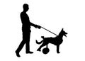 Silhouette Owner keeps her dog on the leash in a wheelchair