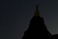 Silhouette of pagoda buddhism against night sky with copy space stars background. Royalty Free Stock Photo