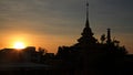 Silhouette of pagoda and city against sunset Royalty Free Stock Photo