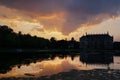 The silhouette of the Palais and the pond in the park \