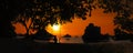 Silhouette of Panoramic landscape of Ang Thong archipelago island in Thailand with a girl sitting on a swing or cradle on the